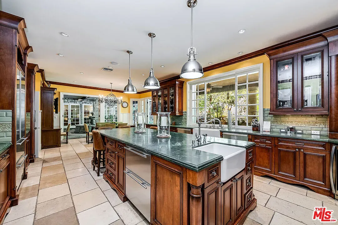 Here's the kitchen. mahogany everywhere, big shiny island. Smells slow roasts.