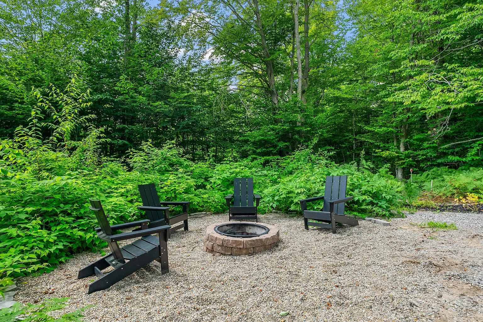 Fire pit circle on gravel. Rustic stones, looks perfect for late-night marshmallows.
