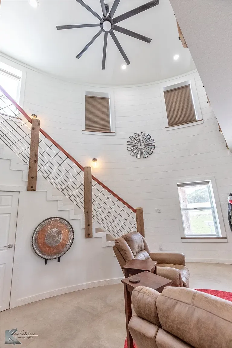 Big modern fan in the silo peak. Dramatic, feels a pavilion. Maybe too much?