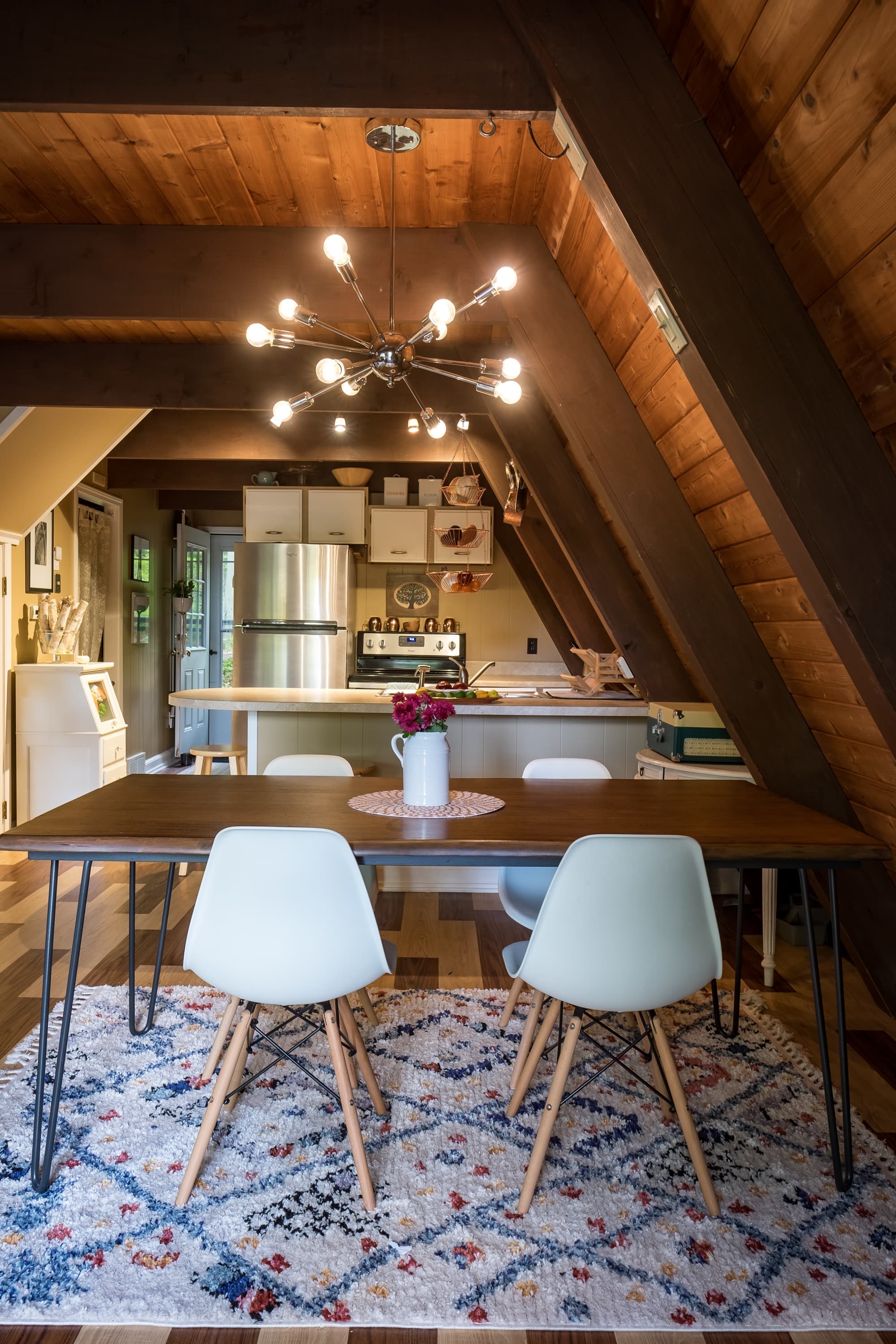 "Cozy A-frame dining space with mid-century charm and mountain cabin vibes!"