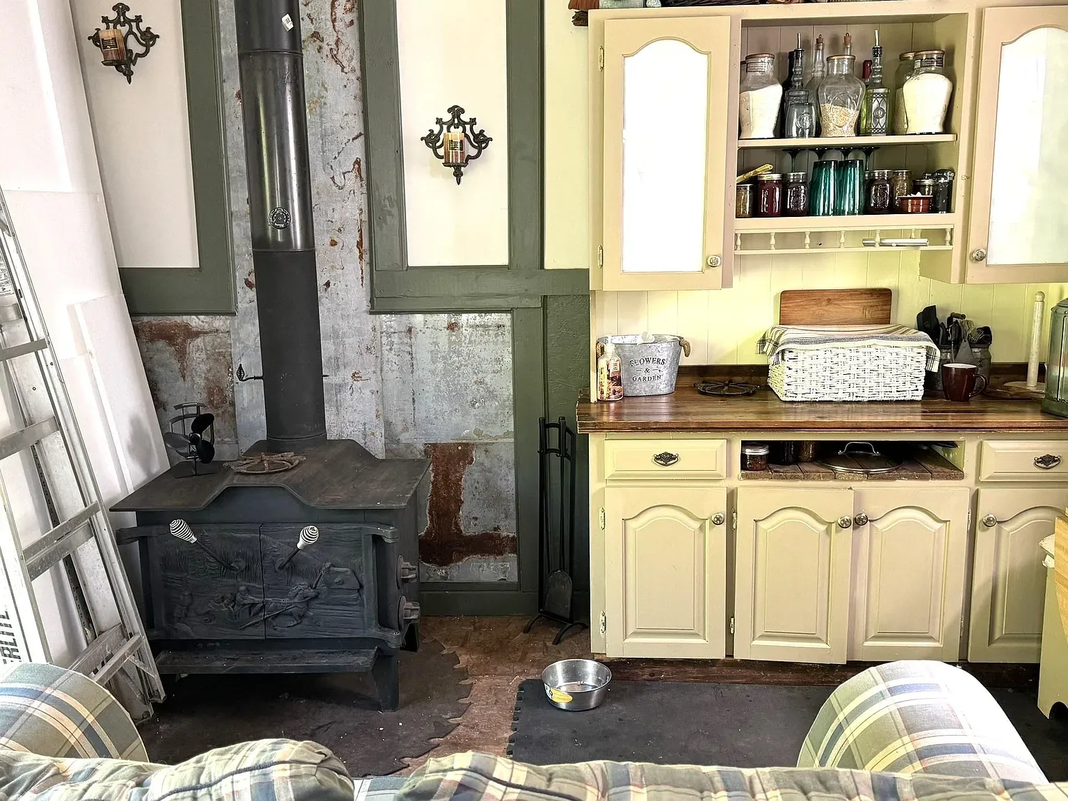 And then this black stove against corrugated metal. Cozy, slightly industrial. Not sure together.