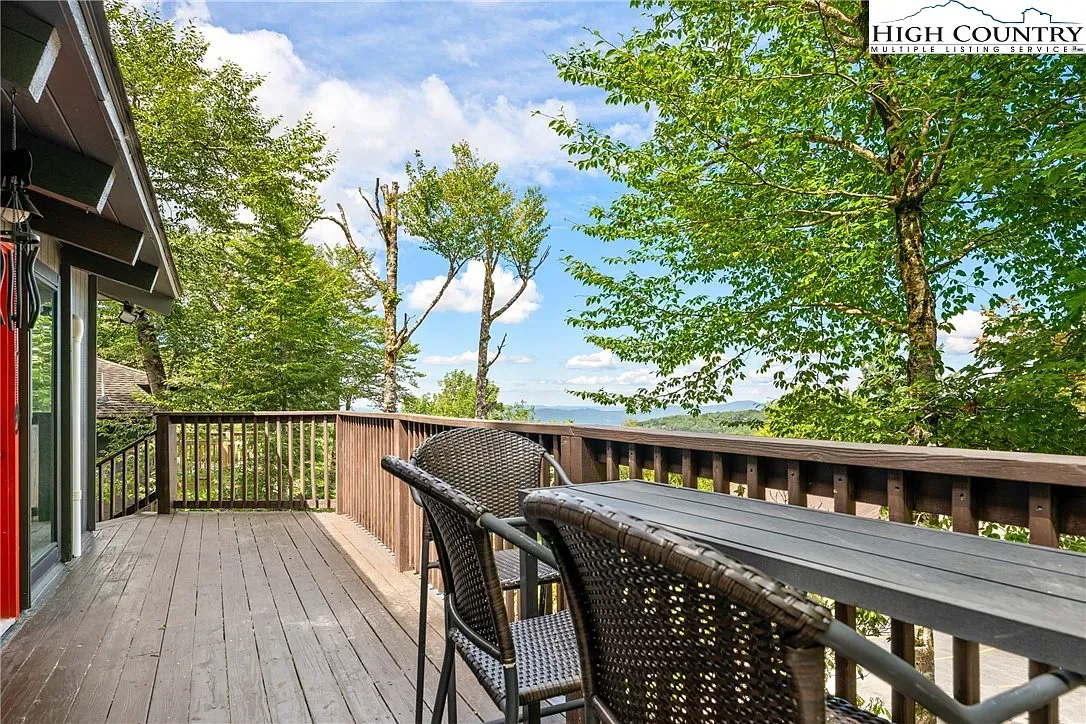 ## Follow the grain to the deck—rich wood, weathered planks, and a calm view set the mood.