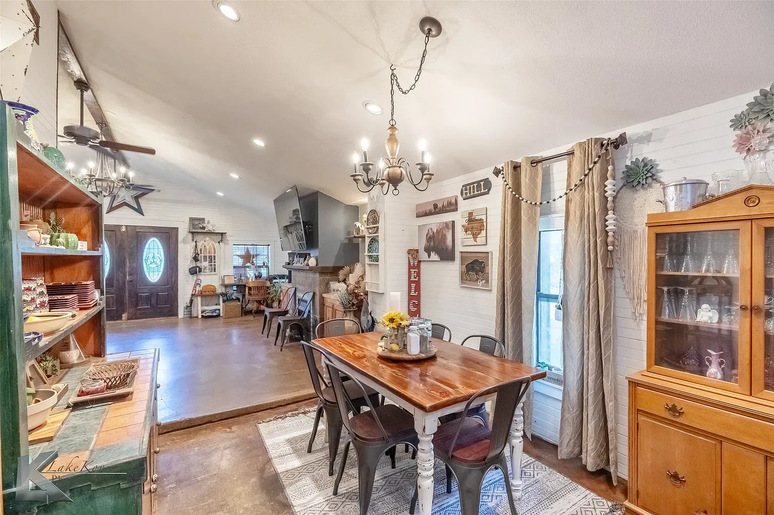 Dining area keeps it simple—wood table, metal chairs. Solid Airbnb energy.