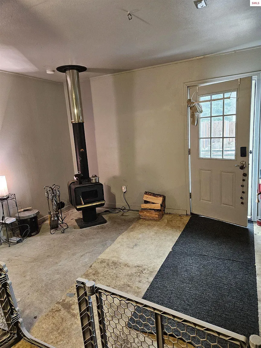 And then a wood stove corner. Black iron against light walls looks great.