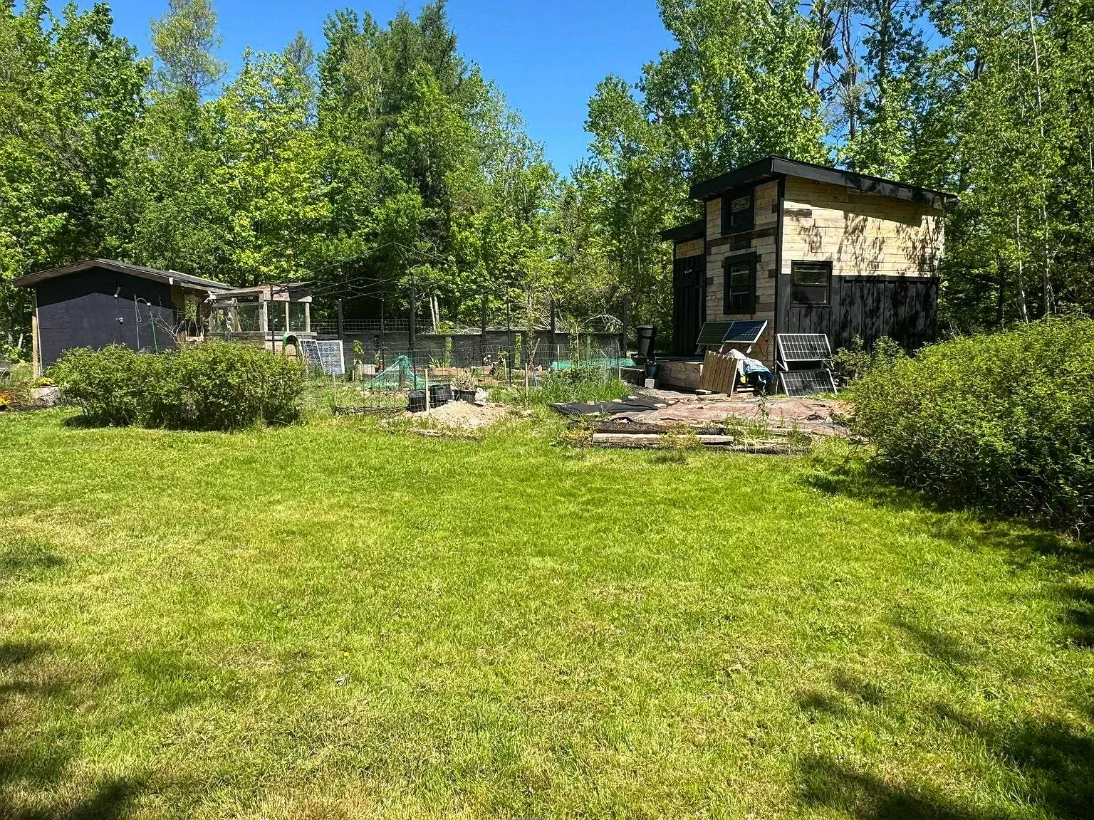 Back outside — tidy lawn, little path lines. You can hear the quiet.