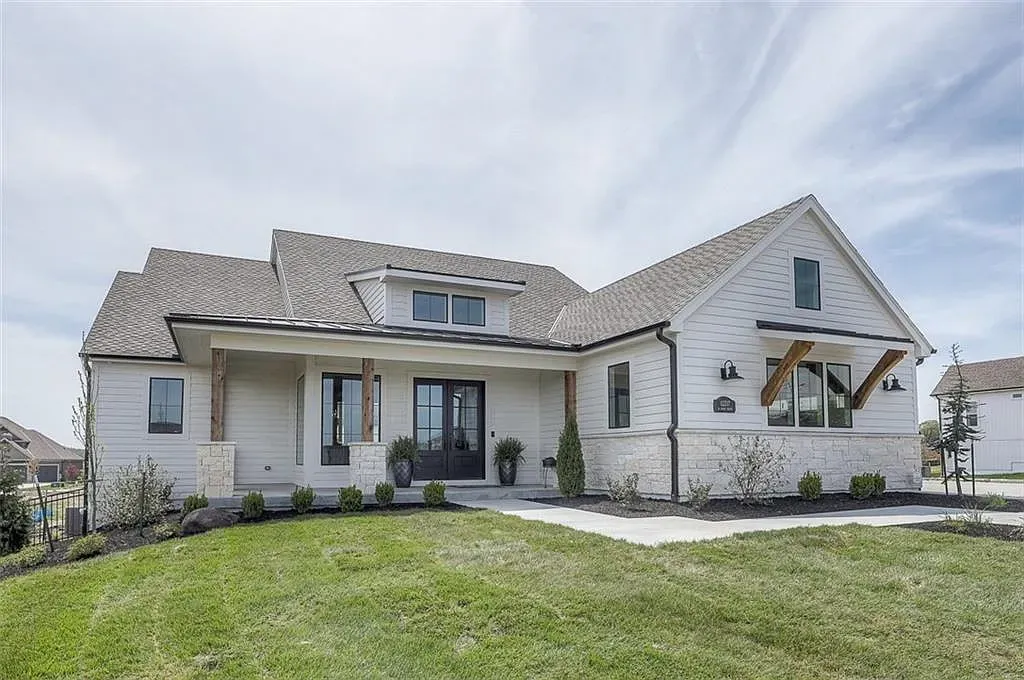 Here's the exterior—crisp white farmhouse vibes. Clean, bright, kind of perfect.