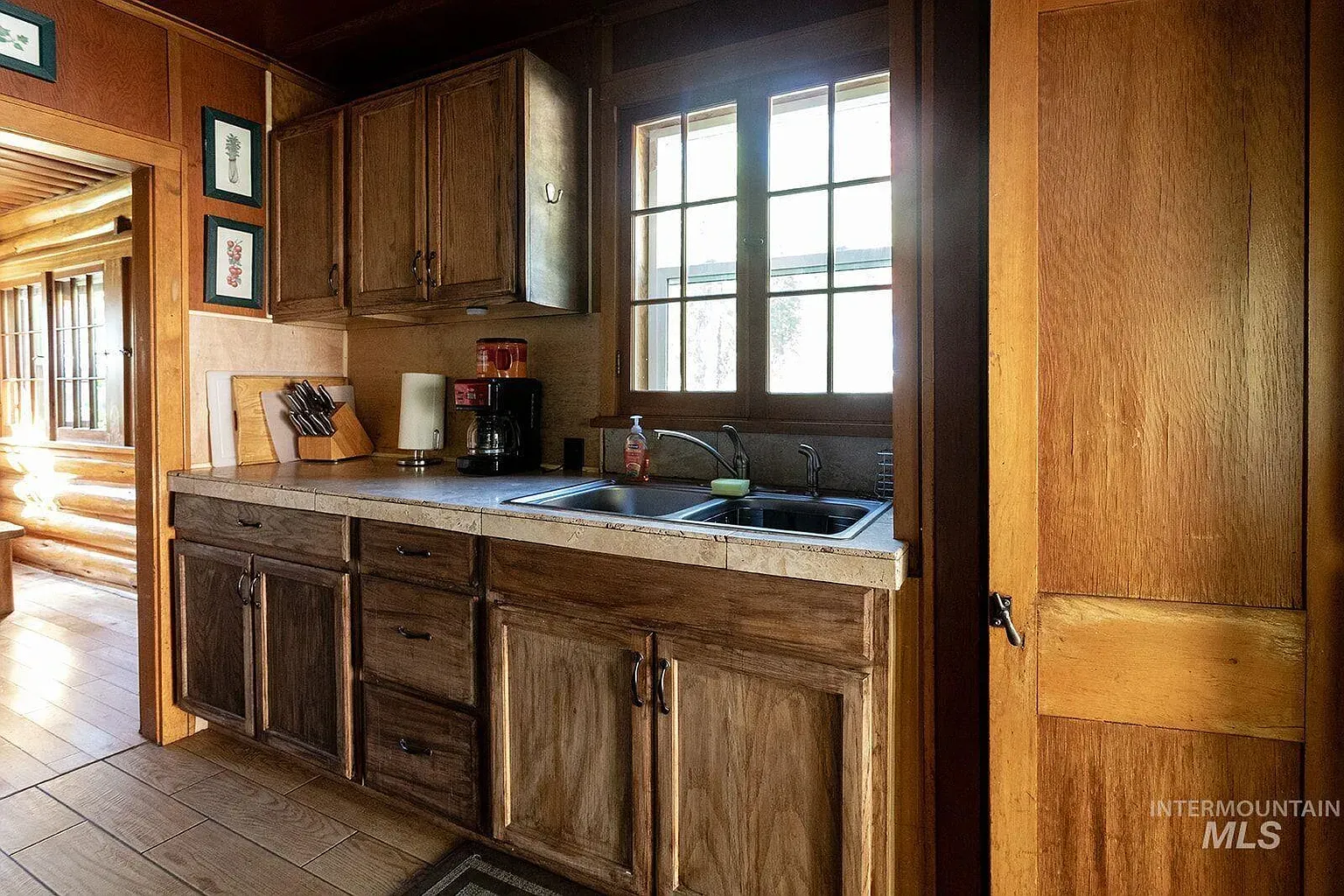 ## Inside, rich weathered wood shows off its grain; light, textured counters brighten things up—rugged meets refined.