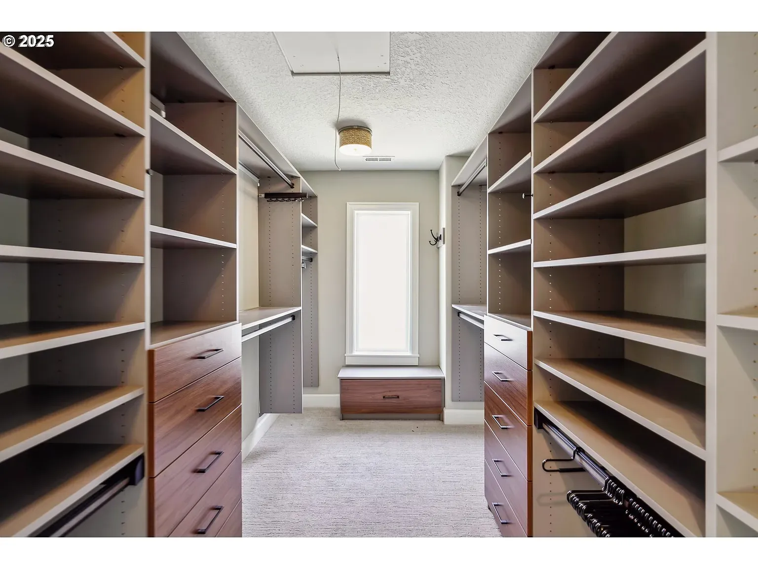 And then a giant closet — beige on beige, plush carpet underfoot.
