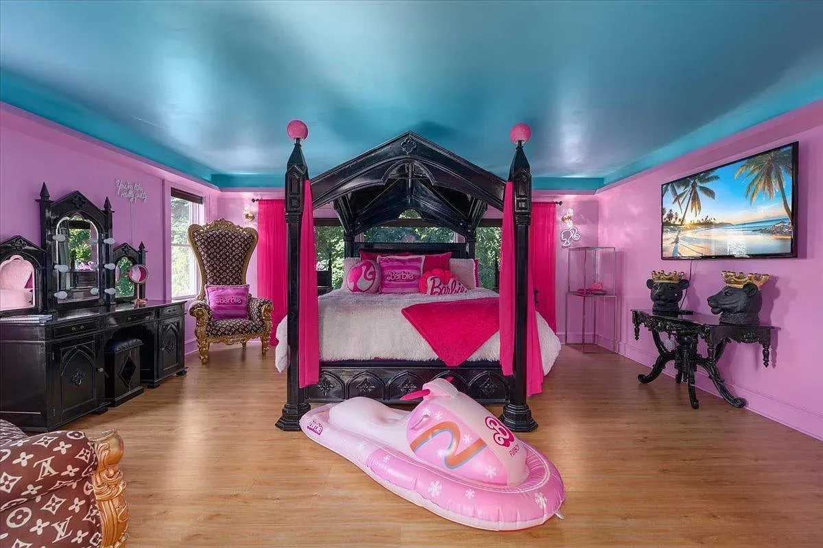 ## Bold pink bedroom meets a sleek black four-poster; the contrast feels chic and a little glam—great spot for dramatic linens.
