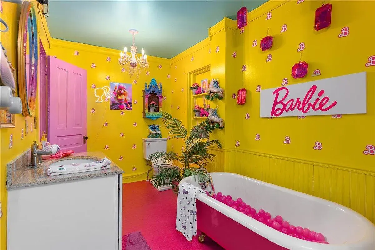 ## Sunny yellow Barbie bath goes cheerful, with pink accents dotting the room—cute mirrors and trim that make washing hands feel like play.