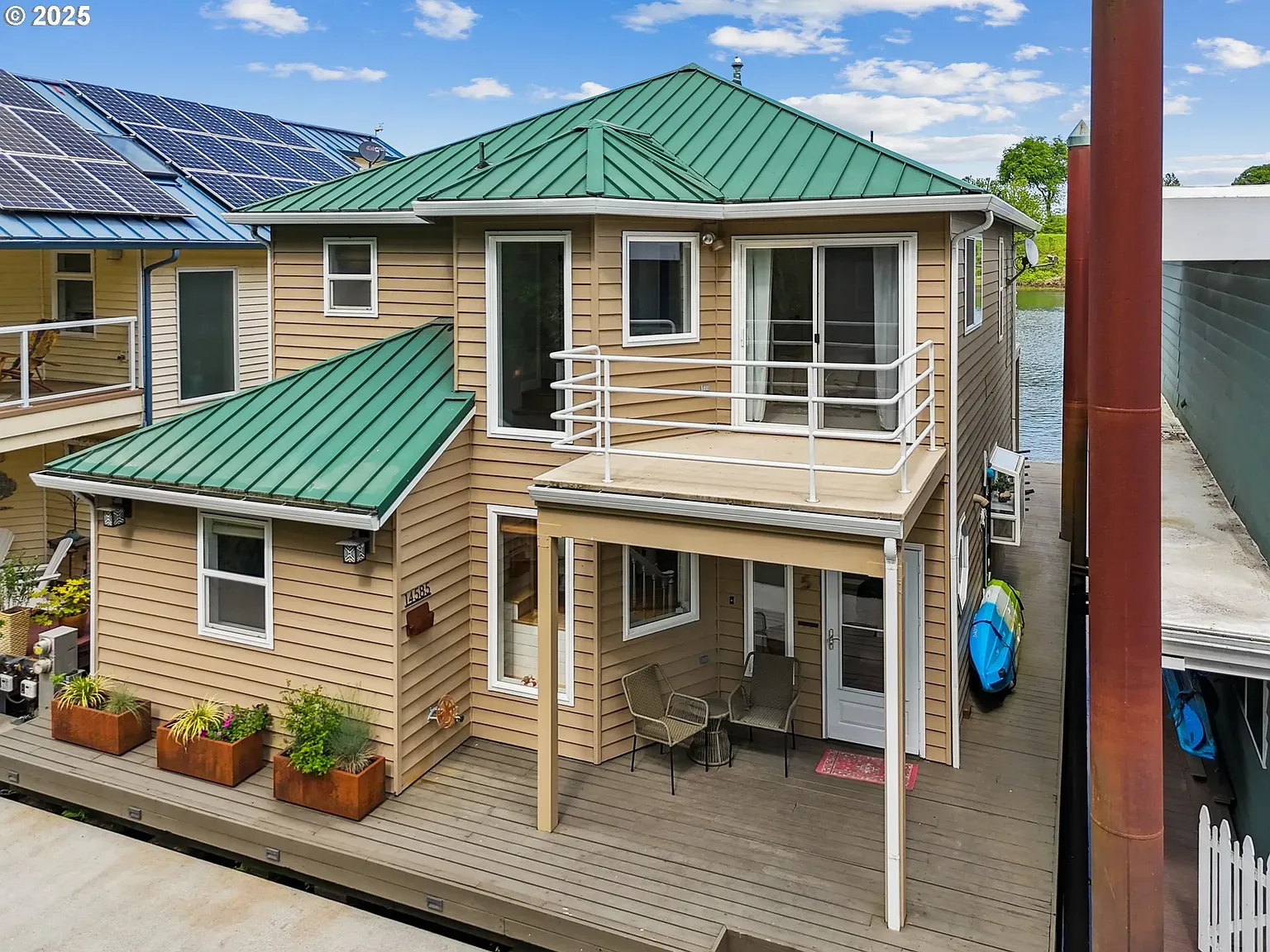 Another exterior — beige wood plus green roof. Anyone know why that combo everywhere?