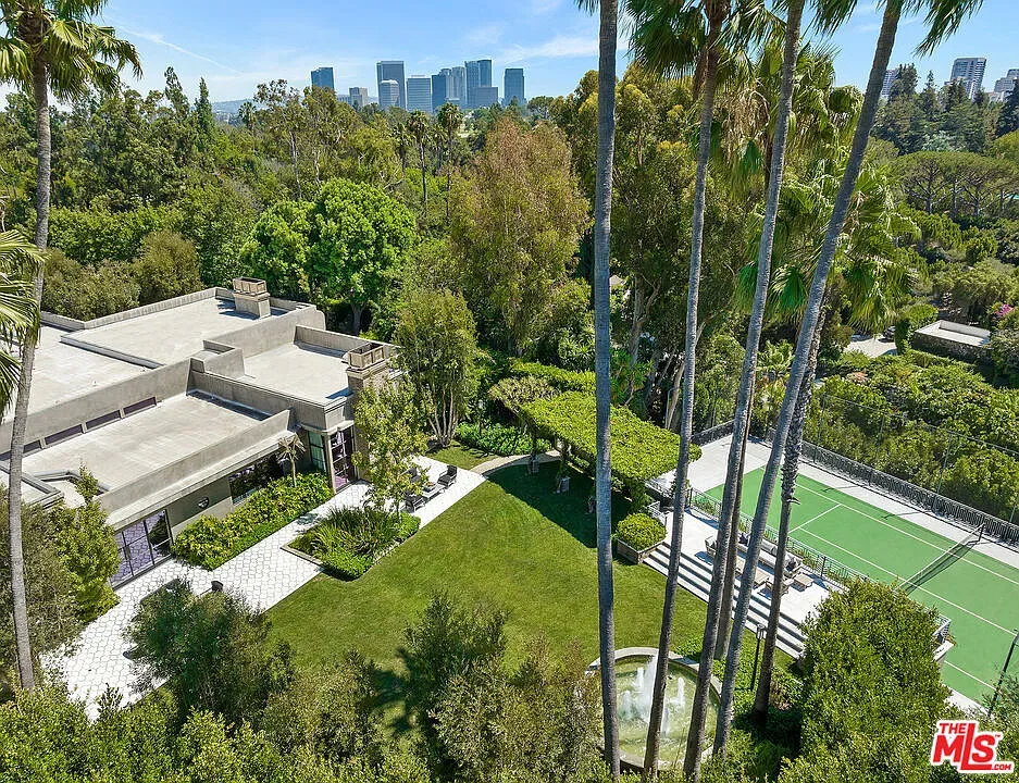 Back outside. big concrete statement house. Brutal-ish, but softened by lawn.