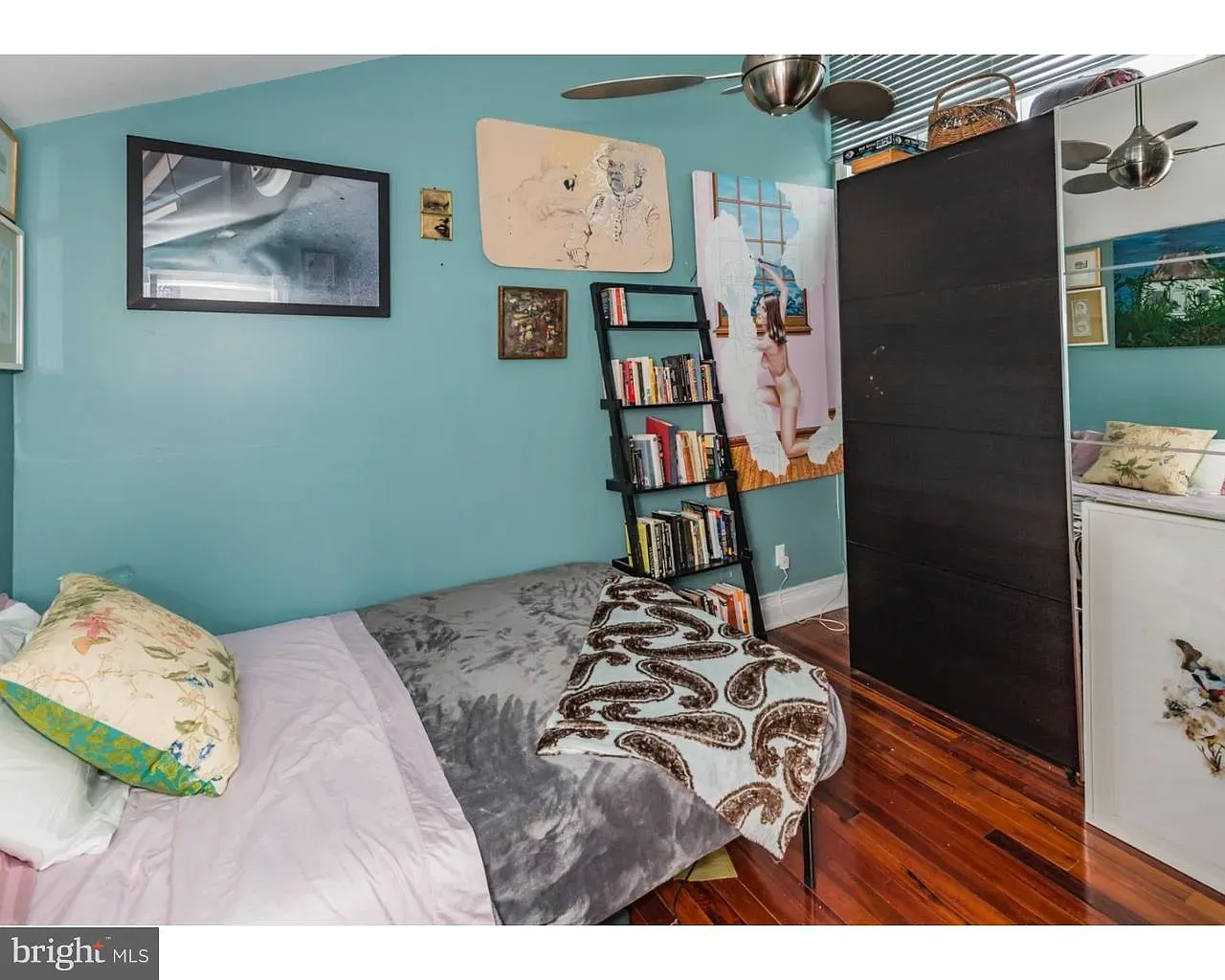 Turquoise room with warm floors—cheerful but calm. Plants would crush in here.