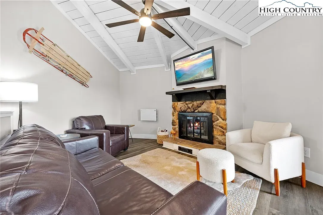 ## Fireside hangout feels classic: stone hearth, high beamed ceiling, and a layout that invites conversation.