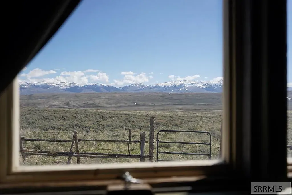 “Just look at that view! The mountains are stunning, and you can see for miles across the open landscape. It's such a peaceful spot to take it all in.”