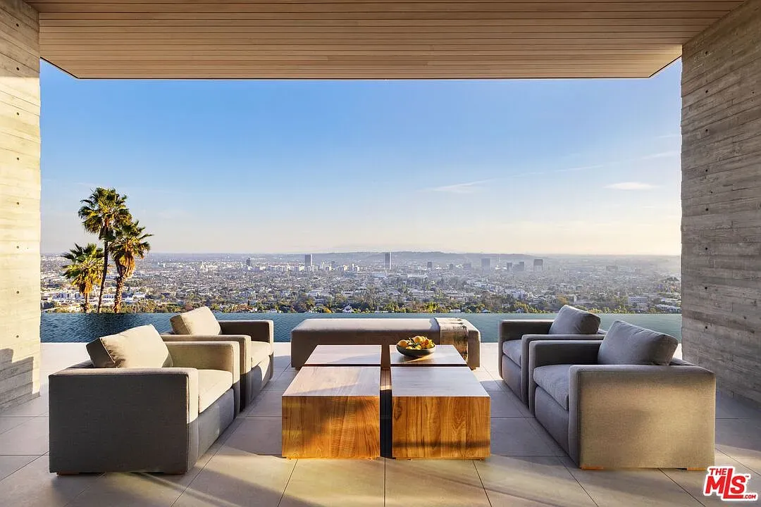 Back outside — concrete frame, glass everywhere, horizon just lives here.