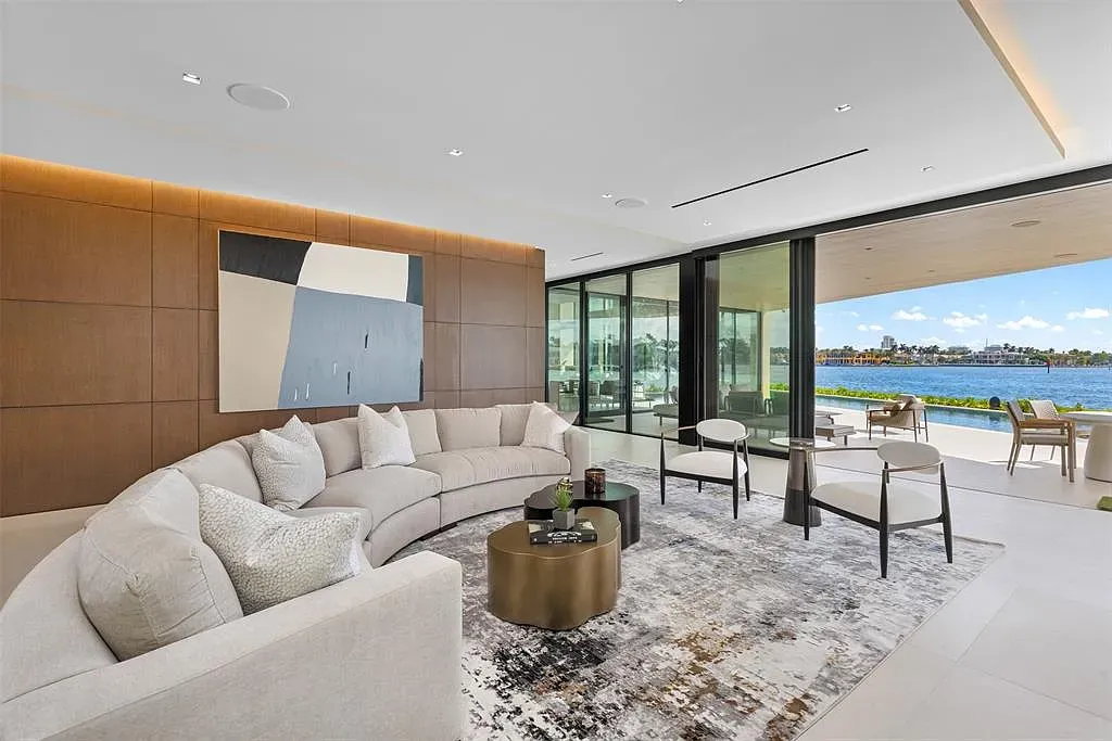 Here's the lounge—soft neutrals with deep blues. Water views doing the mood lighting.