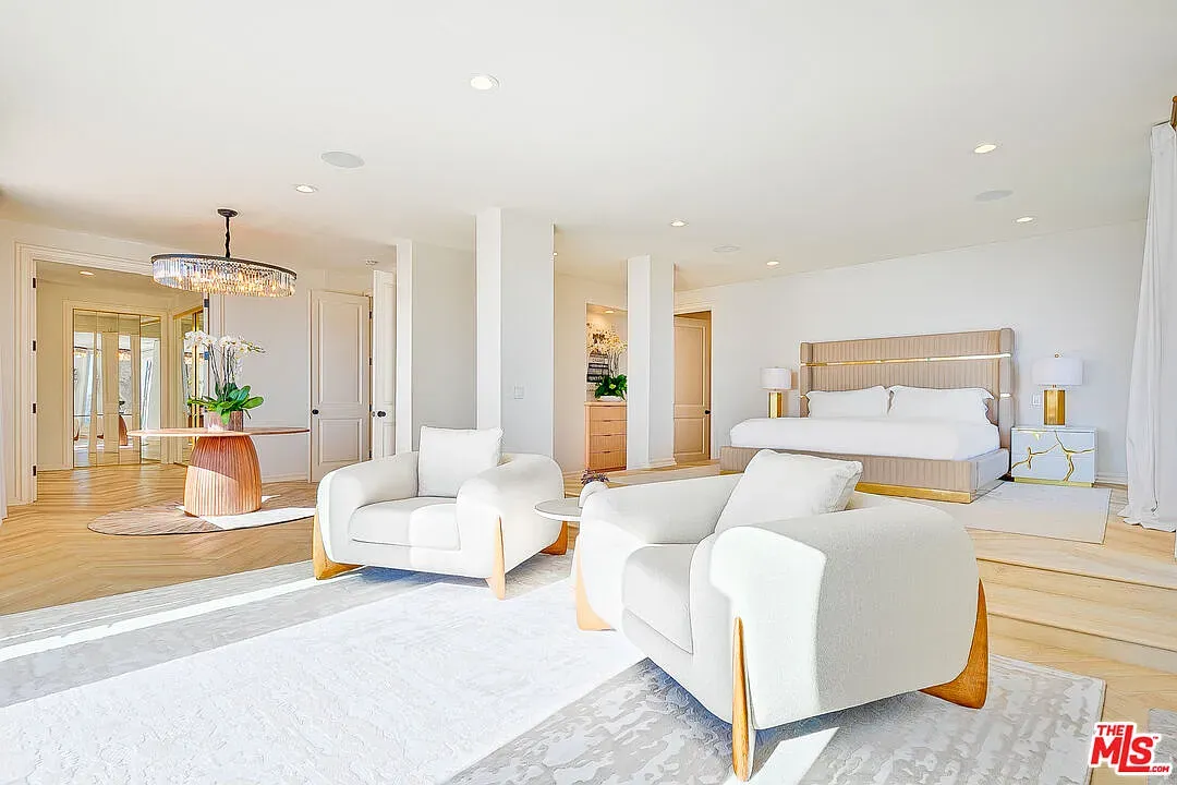 Guest room feels fresh. Polished floors, soft walls, easy morning light.