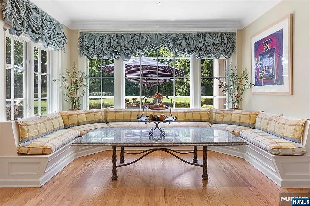 Cozy window nook with plaid cushions. Tea spot secured.