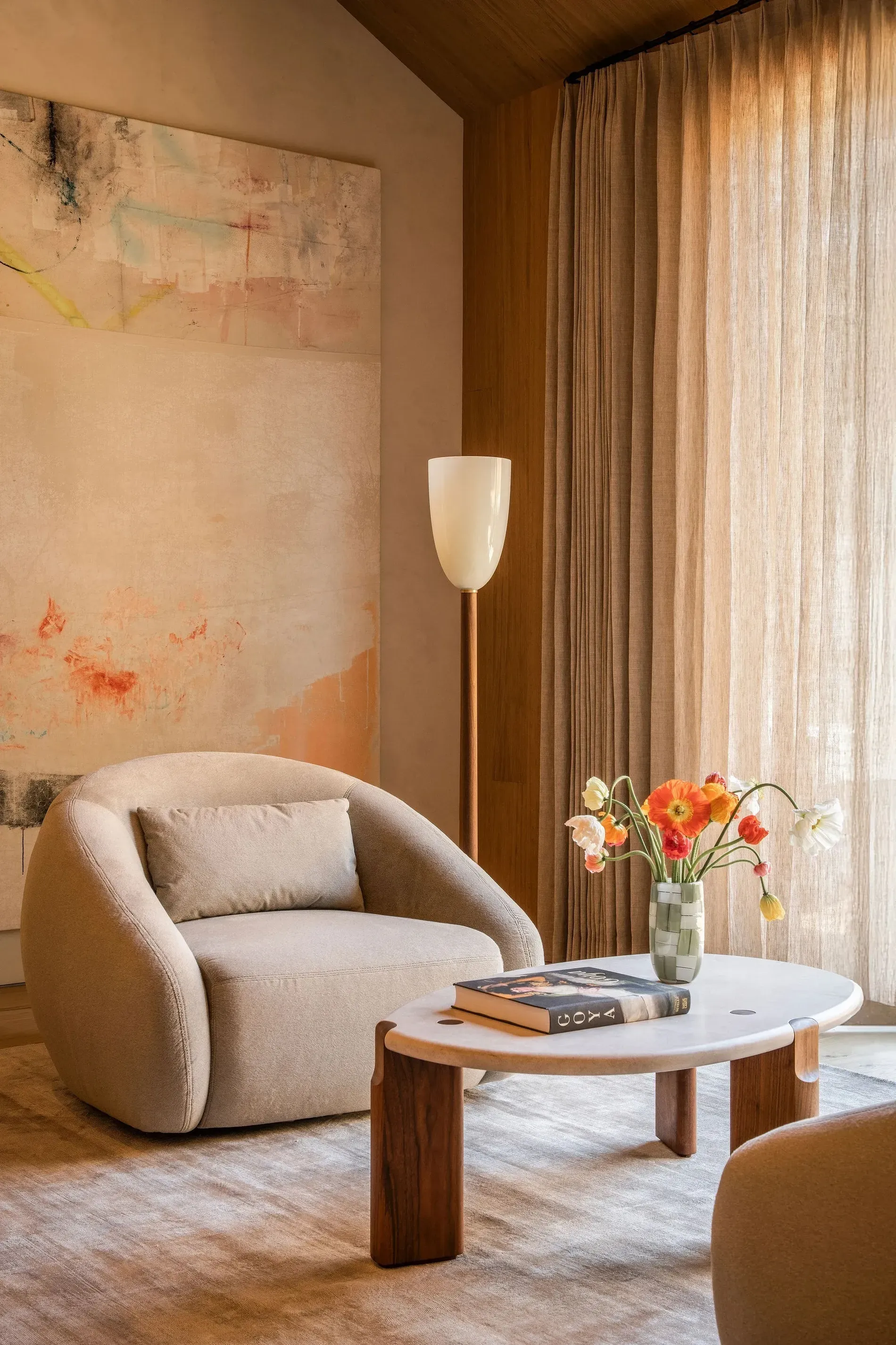 This chair is a croissant. The marble oval keeps it from looking too mushy.