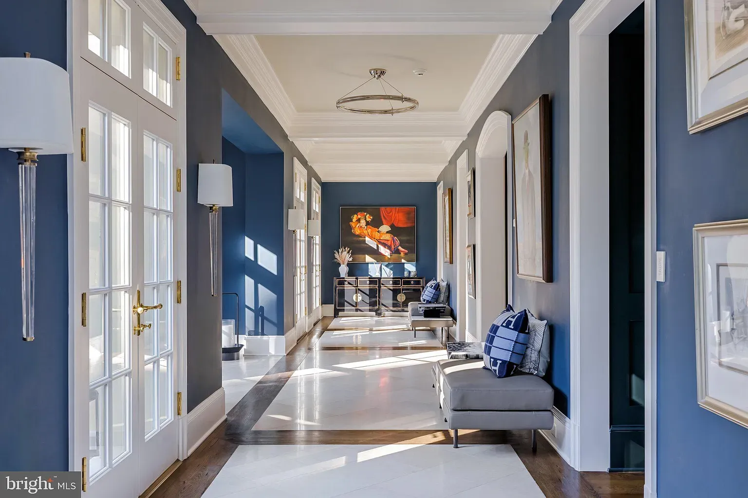 And then this hallway—deep blue, white trim popping. Ceiling details flexing.