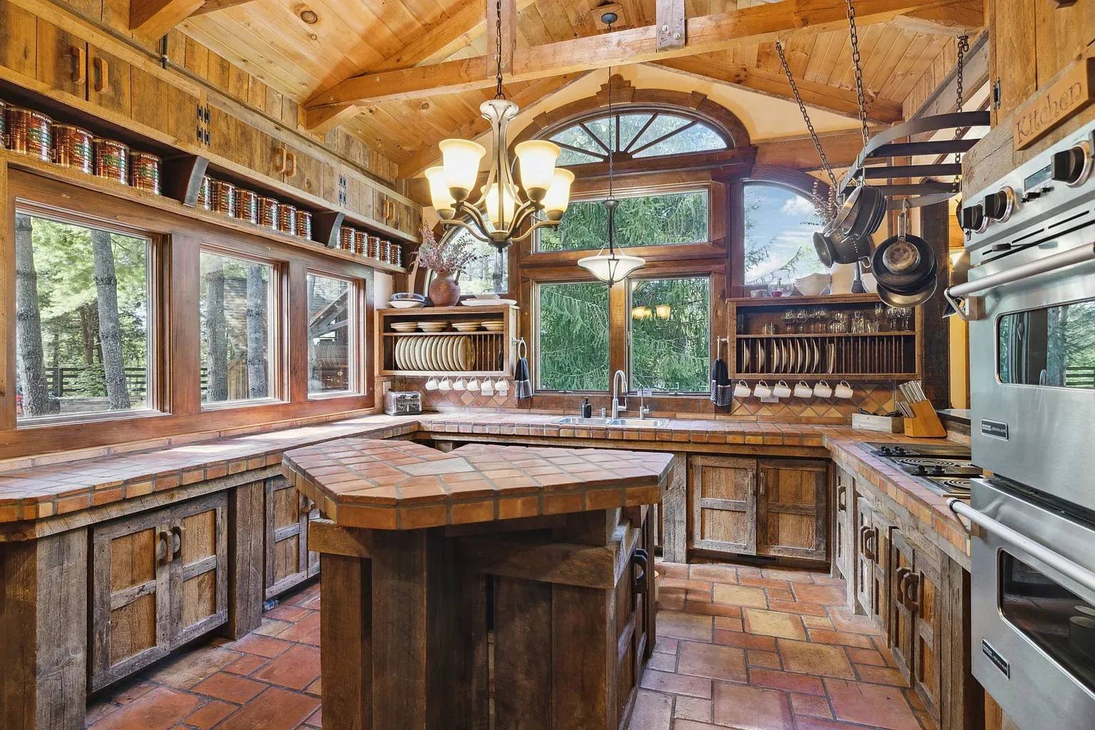 If beams could hug, this kitchen would be smothered. Sunlight everywhere, wood for days.