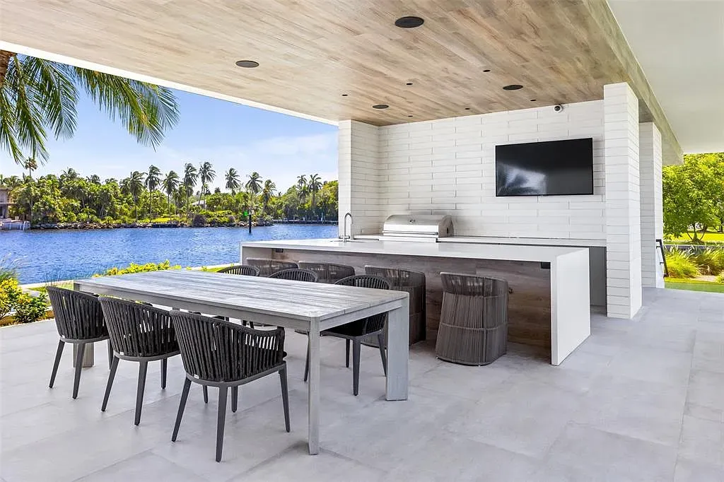 Big tile patio begging for barefoot mornings and an irresponsible amount of string lights.