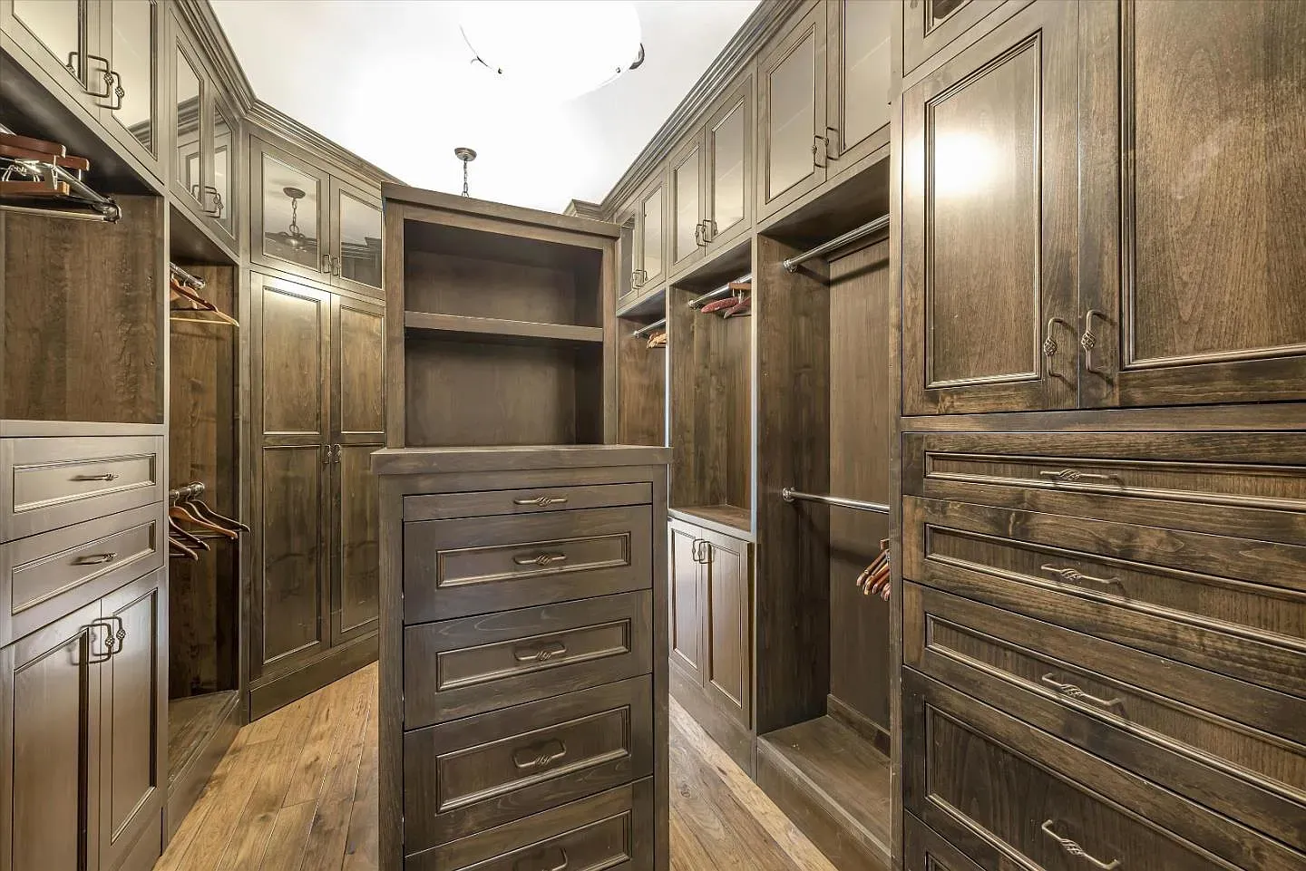 Closet is basically a boutique. Dark wood and brass everywhere. So much storage.