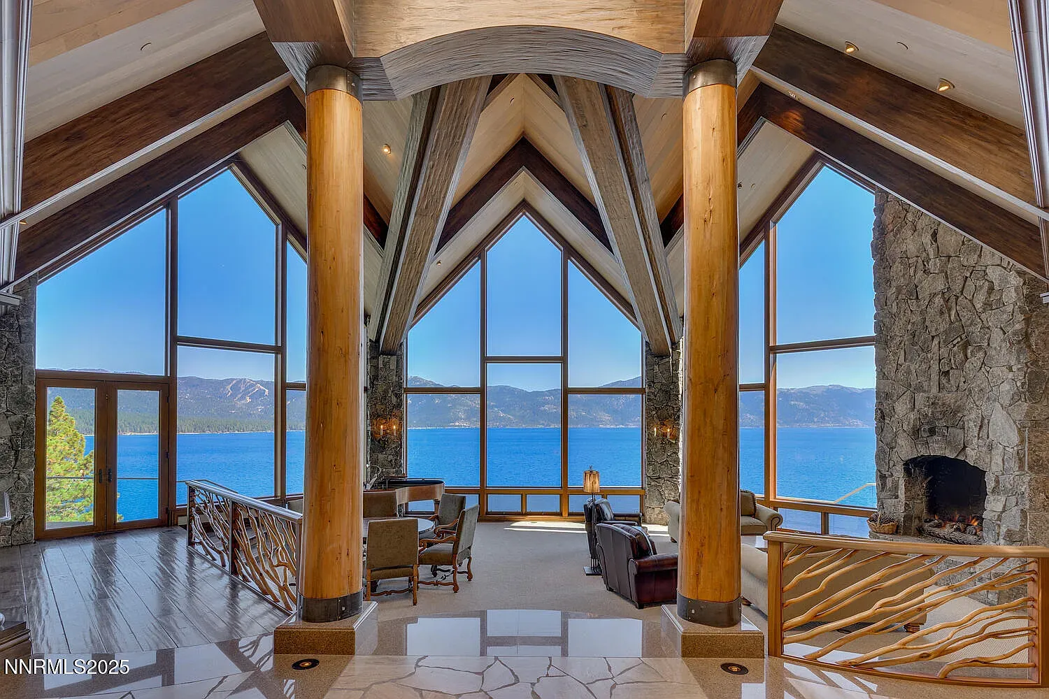 Cathedral windows straight to the lake. Nature’s IMAX in the living room.