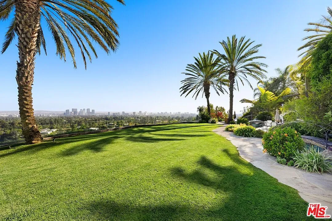 Back outside—mega lawn alert—palms tossing shade celebrities. Who’s mowing this every week?