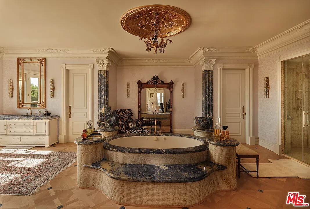 Round tub with blue-gold mosaic. Gorgeous, but cleanup sounds terrifying.