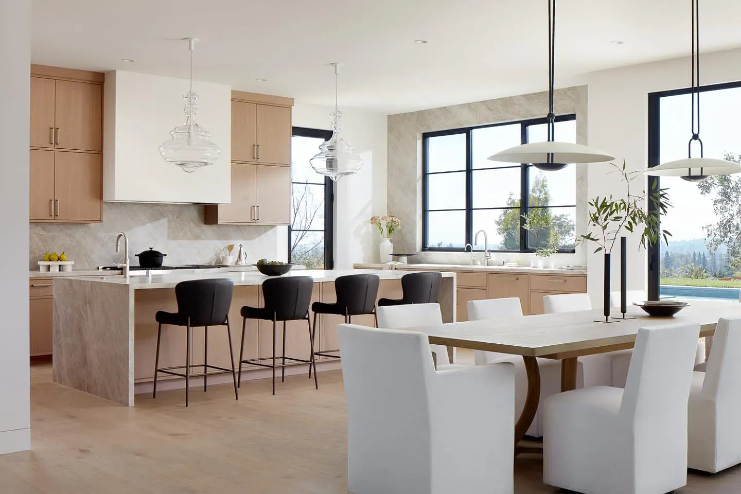 Warm wood cabinets and light marble. Quiet kitchen flex without trying.