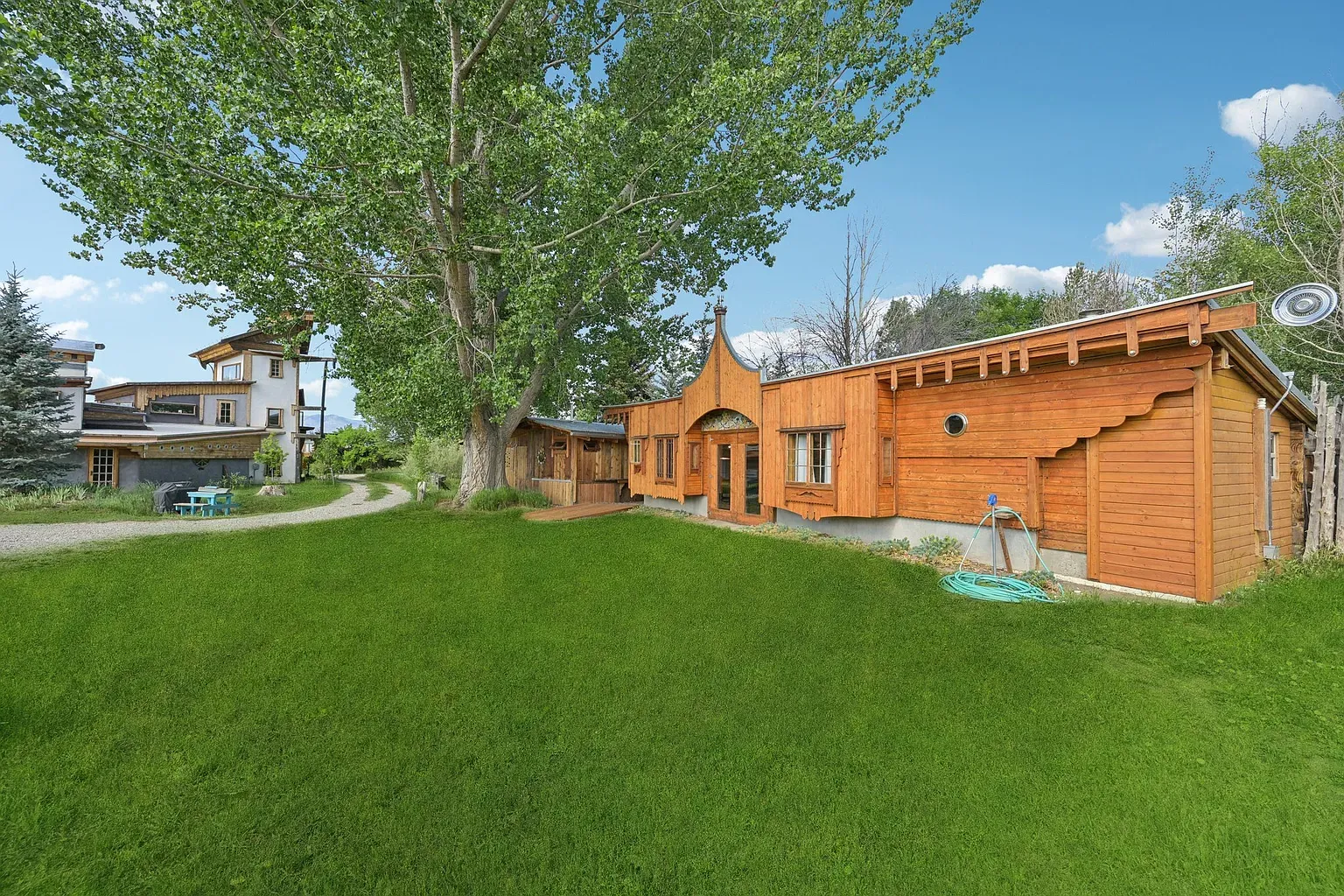 Playful exterior—modern lines with whimsical touches. That orange brown wood looks great.