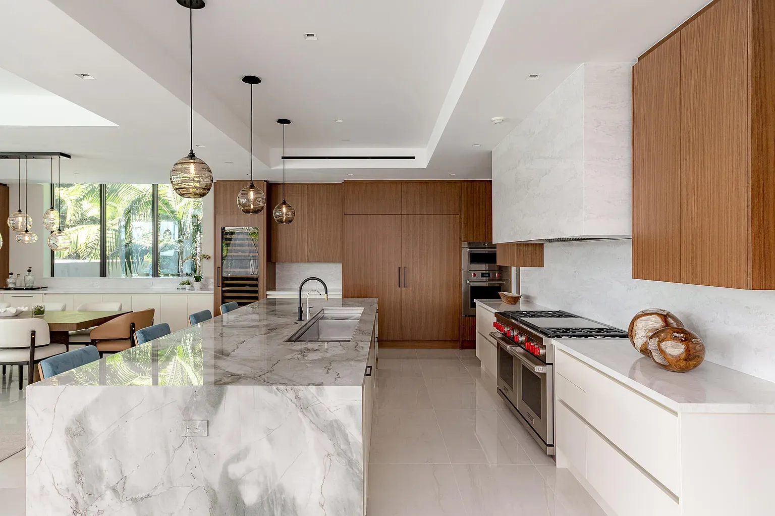 Okay, this island—white marble waterfall. Gorgeous, but who polishes this every week?