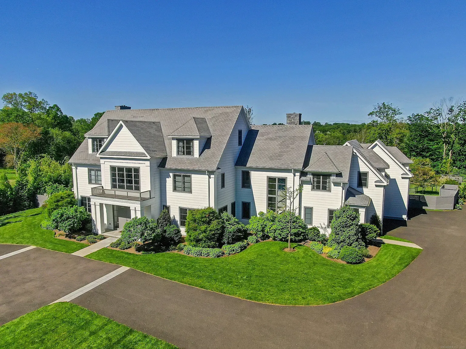Here’s the front—crisp white, charcoal accents, gables and dormers really pop.