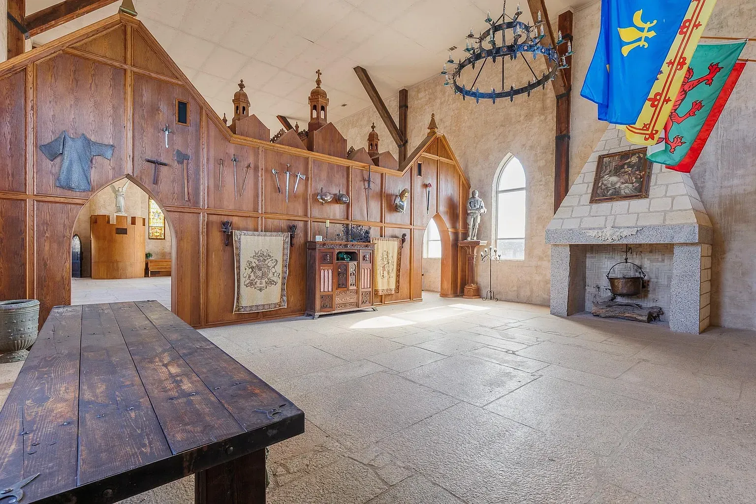 Someone leaned into the medieval theme. Carved wood paneling, swords, shields—the whole set.