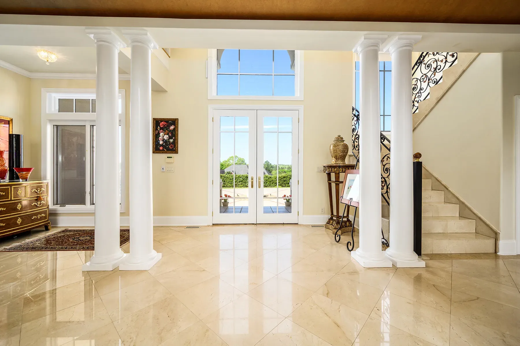 Foyer flex—creamy marble and columns a hotel lobby.