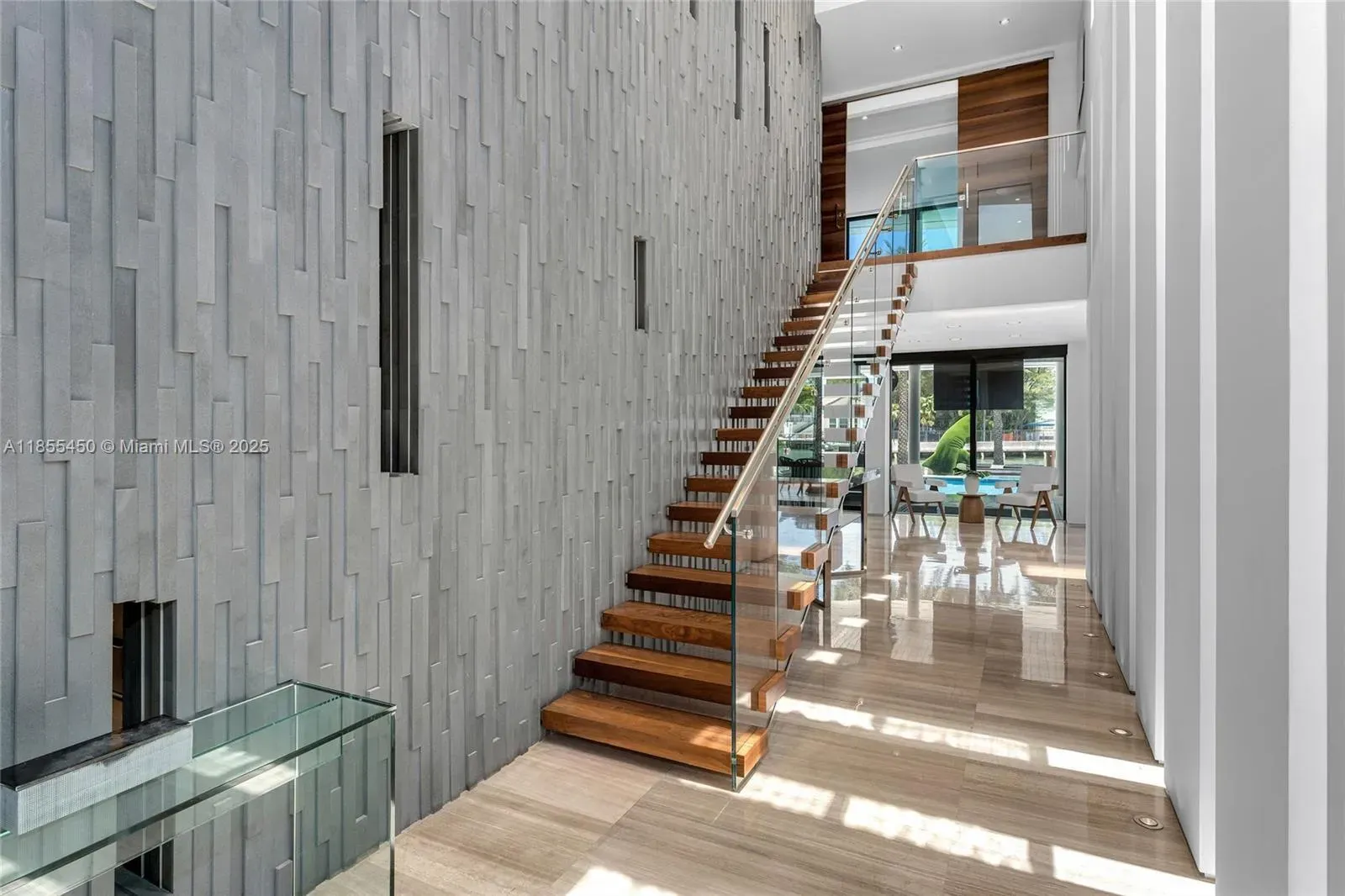 Foyer floods with daylight. Gray feature wall actually works. Anyone else impressed?