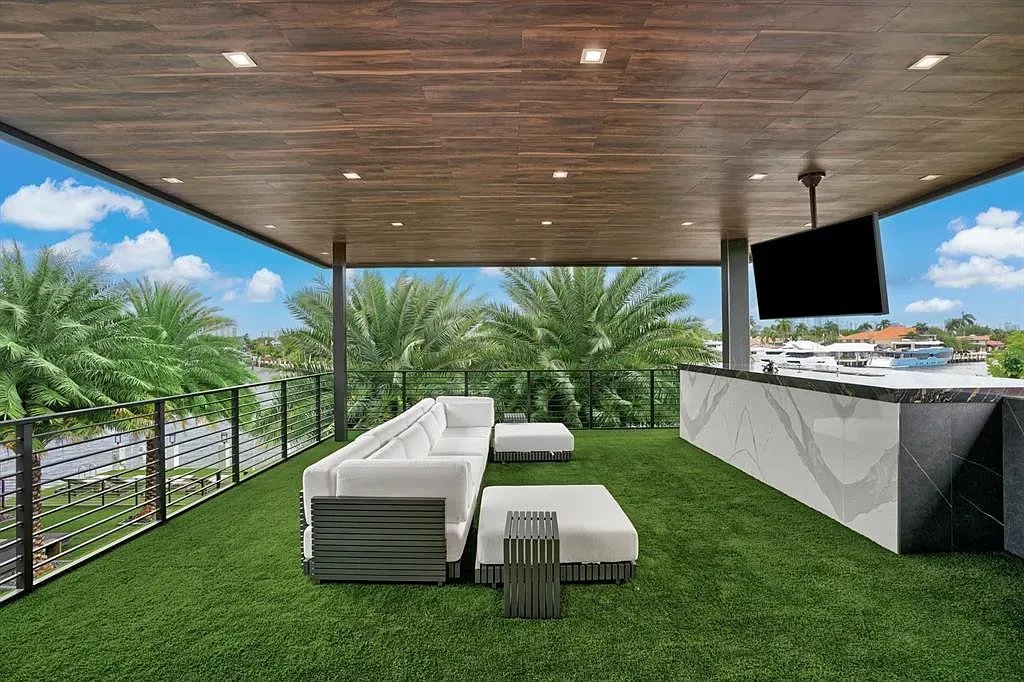 Outdoor living room on turf. Low sofas, clean lines, easy breezy hangout.