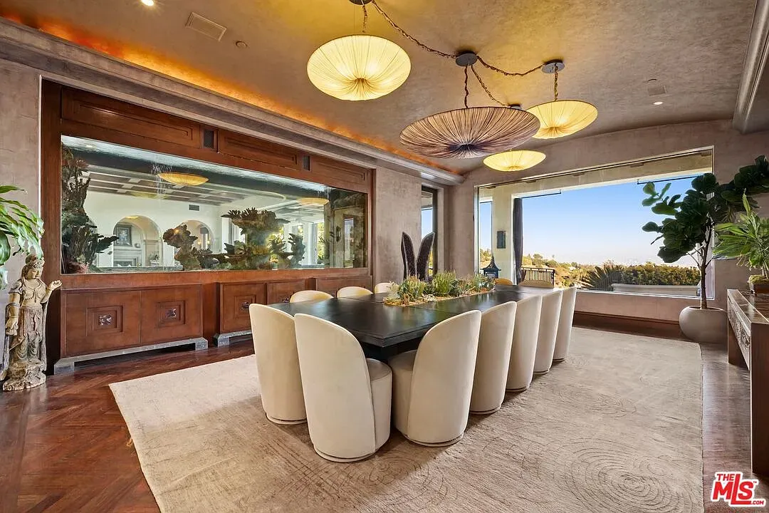 Dining room whispers, doesn’t shout—taupe everywhere, soft light, ready for long dinners.