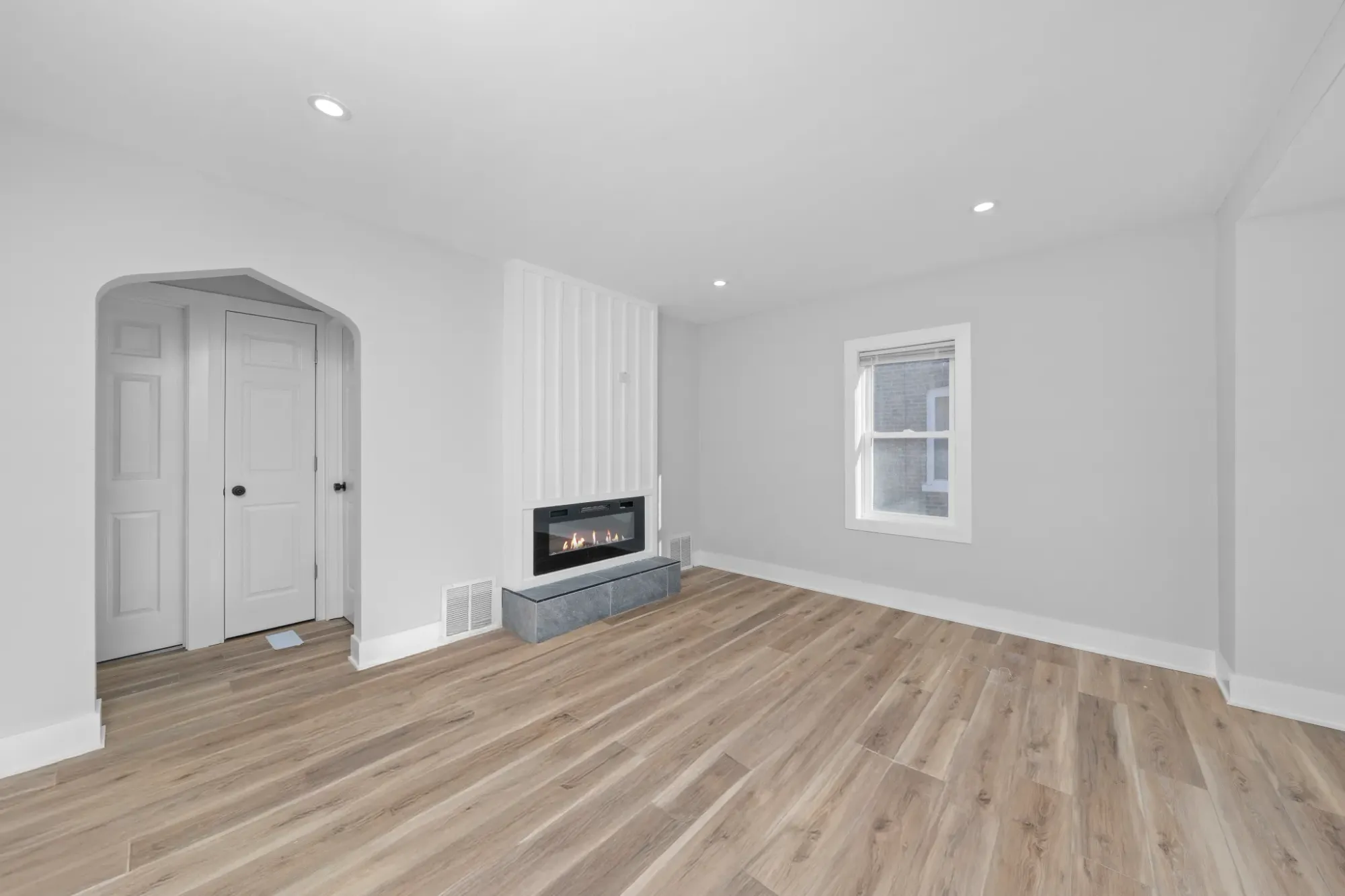 Simple white room. Feels airy, calm. Kinda waiting for art or plants.