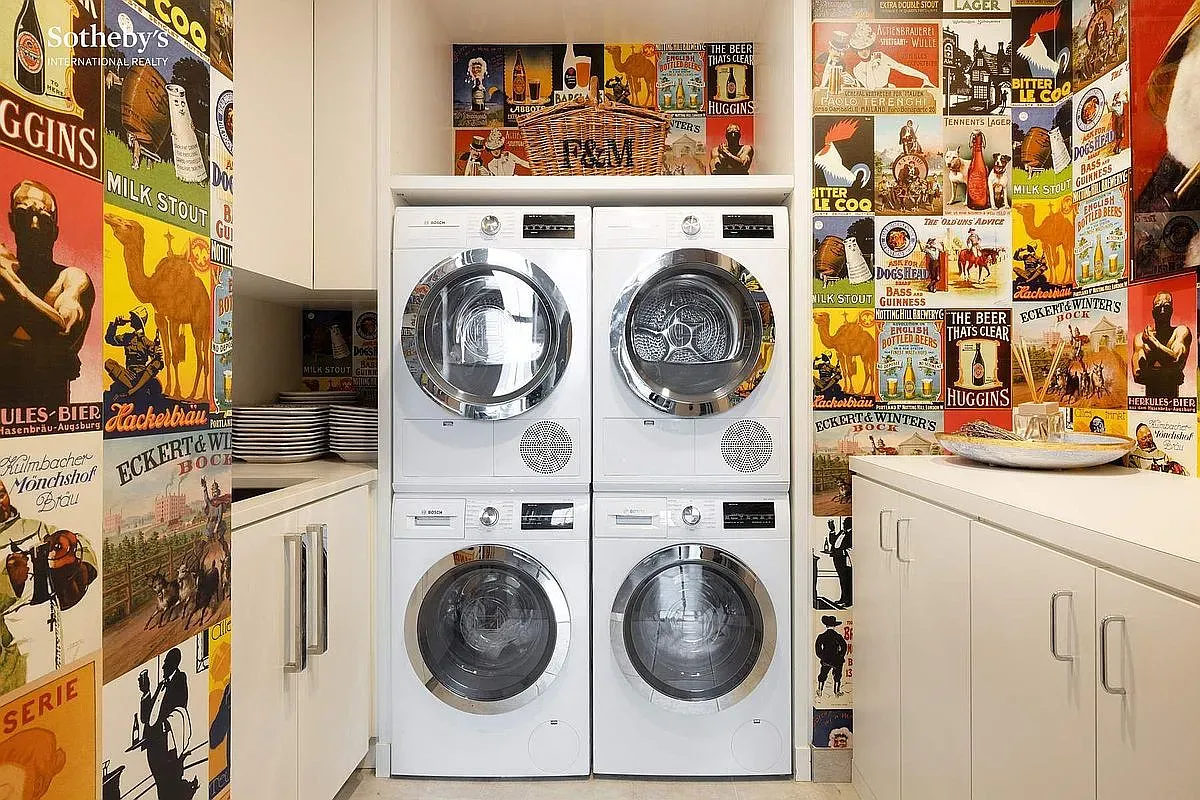 Laundry room but make it gallery wall. Wild posters, folding table, somehow works.