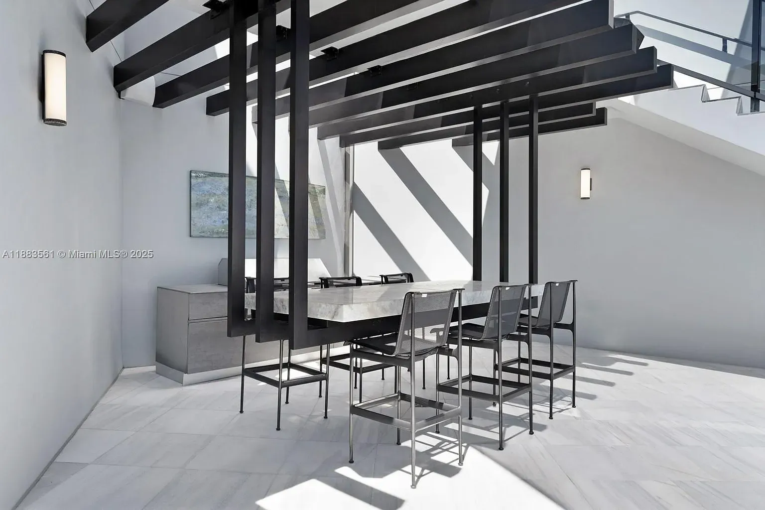 Dining room flexing that stone slab. Eight chairs says we’re hosting, obviously.