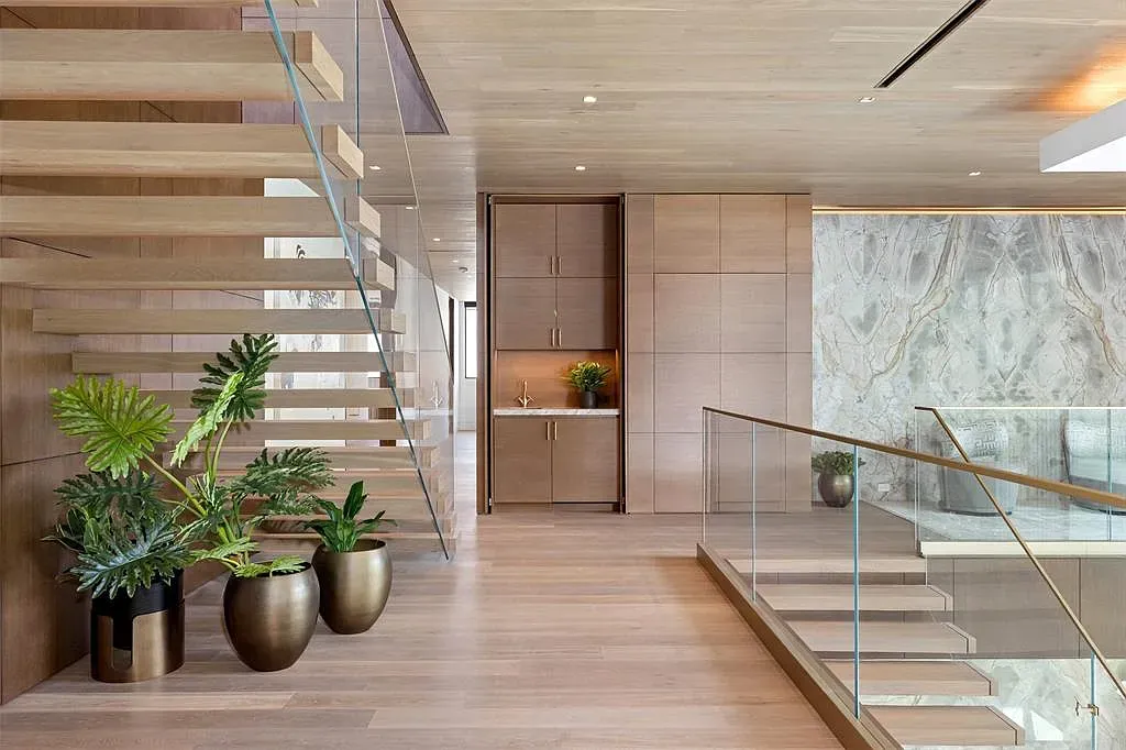 Here's the foyer—floating wood stairs. Anyone else nervous without risers?