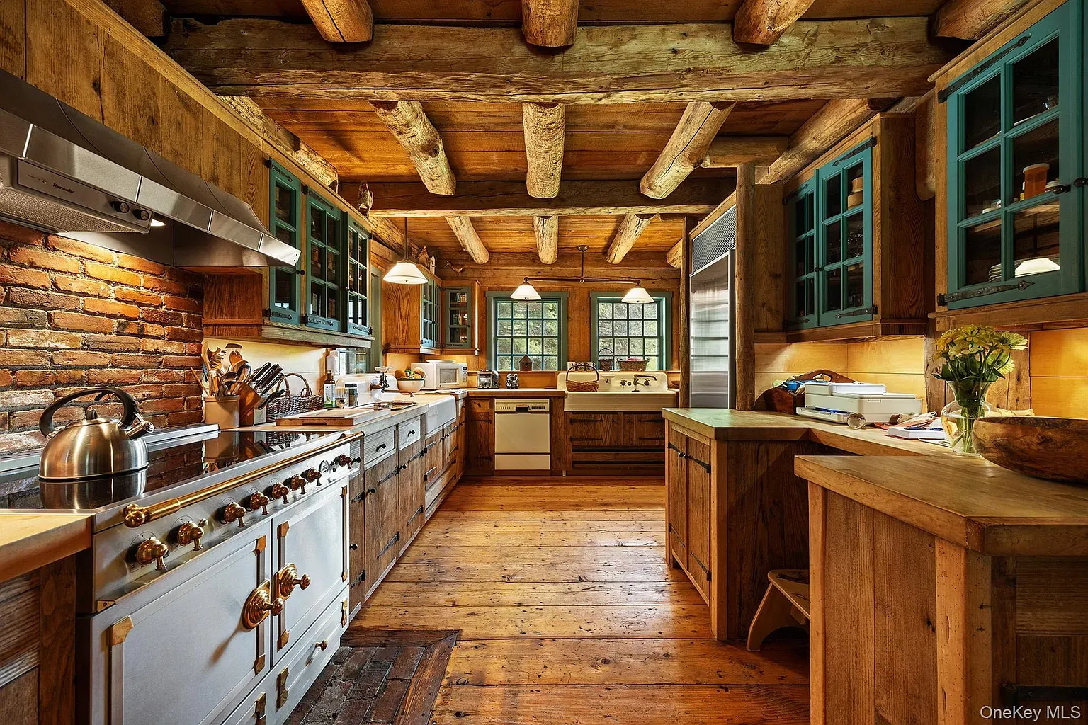 Here's the kitchen—beams, honey floors, chunky cabinets. Smells fresh bread somehow.
