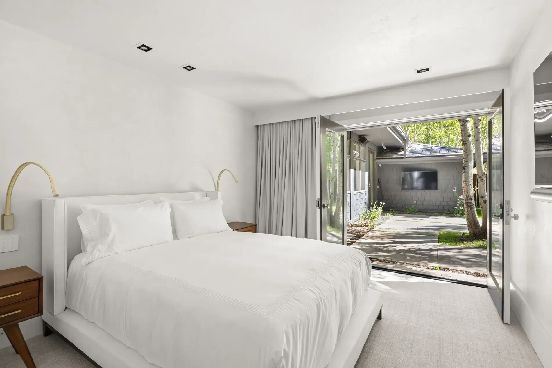 Another white-on-white bedroom. I mean, it’s calming, maybe a touch sterile?