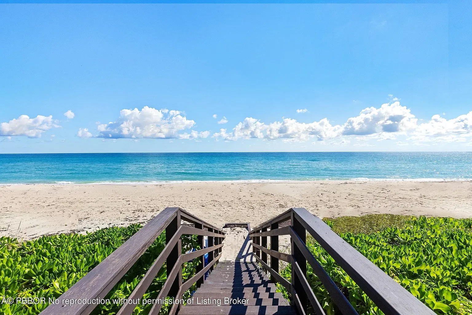 Path down to the beach—sturdy stairs, gentle curve. Instant postcard.