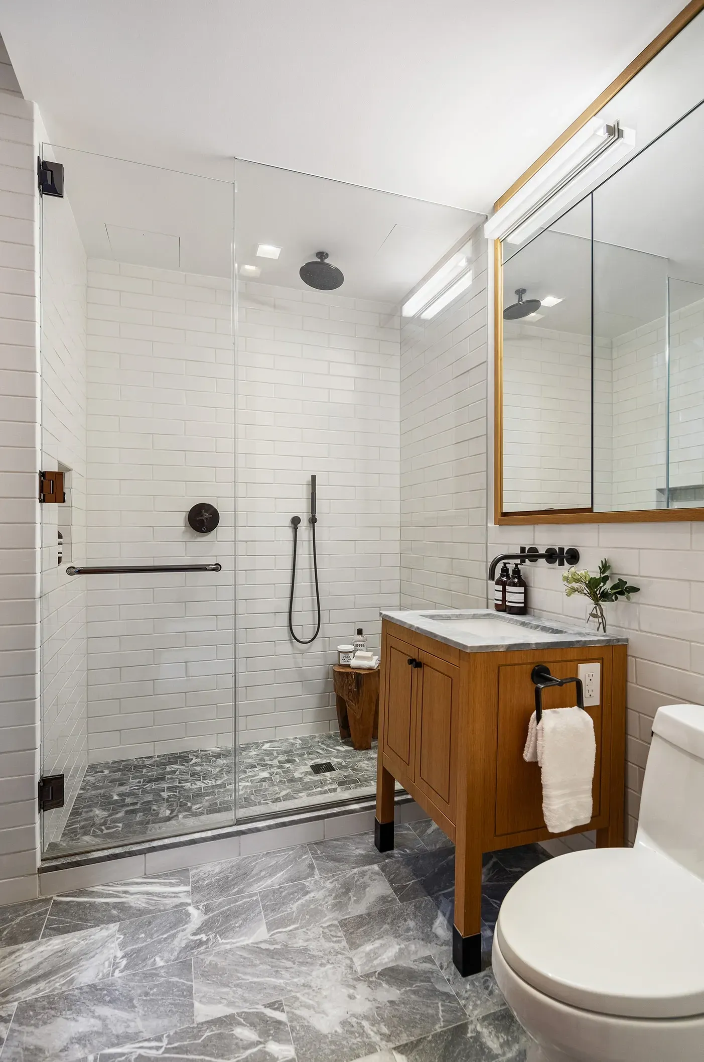 Frameless shower doing the most. Clean lines, but where do towels go?
