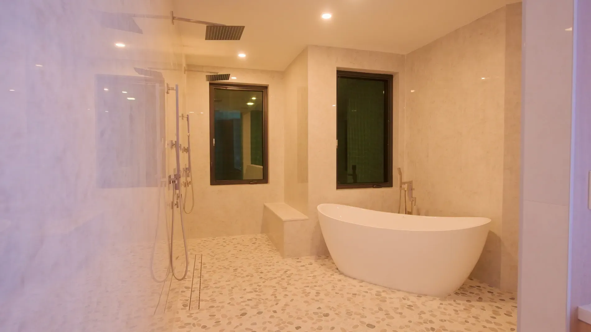 Spa bathroom vibes. creamy marble, pebble floor. Not sure about the pebbles.