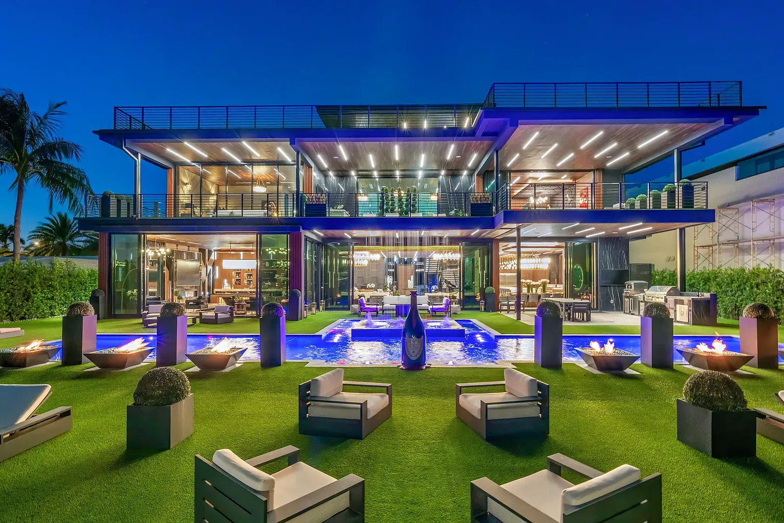 Big glass and sharp angles. Dark metal with wood actually feels warm.